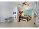 Main bedroom with large bed, sitting area, and artistic wall decor at 2298 Netherlands Dr # 4, Clearwater, FL 33763