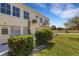 Private patio with seating area and lush hedges at 2298 Netherlands Dr # 4, Clearwater, FL 33763