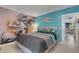 Spacious main bedroom with a large bed and artistic wall mural at 2298 Netherlands Dr # 4, Clearwater, FL 33763