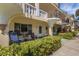 Condo patio with seating area and tropical plants at 2298 Netherlands Dr # 4, Clearwater, FL 33763