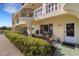 Condo patio with seating area and tropical plants at 2298 Netherlands Dr # 4, Clearwater, FL 33763