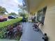 Condo patio with seating area and tropical plants at 2298 Netherlands Dr # 4, Clearwater, FL 33763