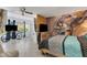 Main bedroom with a large bed and a view of the living space at 2298 Netherlands Dr # 4, Clearwater, FL 33763