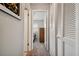 Hallway with carpet flooring and access to bedrooms at 4028 Davit Dr # 4028, New Port Richey, FL 34652