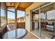 Screened patio with glass door leading to kitchen and view of the community at 4028 Davit Dr # 4028, New Port Richey, FL 34652