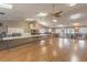 Large community room featuring a hardwood floor and plenty of seating at 4028 Davit Dr # 4028, New Port Richey, FL 34652