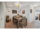 Bright dining room with a wooden table and access to other rooms at 4028 Davit Dr # 4028, New Port Richey, FL 34652