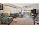 Living room with comfy armchairs and access to patio and hallway at 4028 Davit Dr # 4028, New Port Richey, FL 34652