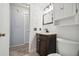 Updated bathroom with vanity, toilet, and linen cabinet at 4028 Davit Dr # 4028, New Port Richey, FL 34652