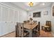 Dining room with wooden table and chairs, and a view of living room at 4028 Davit Dr # 4028, New Port Richey, FL 34652