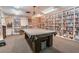 Community library with a pool table and extensive book collection at 4028 Davit Dr # 4028, New Port Richey, FL 34652