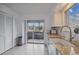 Kitchen with granite countertops, white cabinets and a view to the balcony at 4028 Davit Dr # 4028, New Port Richey, FL 34652
