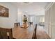 Spacious dining area with wooden table and access to living room and kitchen at 4028 Davit Dr # 4028, New Port Richey, FL 34652