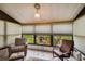 Relaxing sunroom with comfortable seating and views of the outdoors at 4028 Davit Dr # 4028, New Port Richey, FL 34652