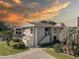 Two-story condo with sunset view and landscaping at 428 Windrush Bay Dr, Tarpon Springs, FL 34689