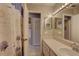 Bathroom with vanity, mirror, and shower at 428 Windrush Bay Dr, Tarpon Springs, FL 34689