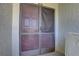 Condo entry with double doors and screen at 428 Windrush Bay Dr, Tarpon Springs, FL 34689