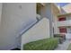 Condo building exterior showing stairs and landscaping at 428 Windrush Bay Dr, Tarpon Springs, FL 34689