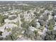 Wide aerial view of a neighborhood near the coast at 428 Windrush Bay Dr, Tarpon Springs, FL 34689