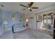 Living room with light gray sofas, ceiling fan, and access to a sunroom at 428 Windrush Bay Dr, Tarpon Springs, FL 34689