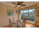 Dining area with glass table, four chairs, and large window at 428 Windrush Bay Dr, Tarpon Springs, FL 34689