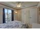 Bedroom with a full-size bed and double closets at 428 Windrush Bay Dr, Tarpon Springs, FL 34689