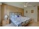 Spacious bedroom with king-size bed, ceiling fan, and coastal decor at 428 Windrush Bay Dr, Tarpon Springs, FL 34689