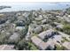 Aerial view of waterfront community with many homes at 428 Windrush Bay Dr, Tarpon Springs, FL 34689