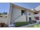 Condo building with stairs leading to the entrance at 428 Windrush Bay Dr, Tarpon Springs, FL 34689