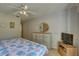 Bedroom with a large bed, dresser, and TV at 428 Windrush Bay Dr, Tarpon Springs, FL 34689