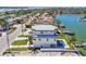 Gorgeous aerial shot of a modern home with a sleek design, overlooking a private pool and waterfront at 2832 W Vina Del Mar Blvd, St Pete Beach, FL 33706
