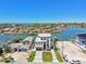 Stunning waterfront home with panoramic views of the bay, lush landscaping, and private boat dock at 2832 W Vina Del Mar Blvd, St Pete Beach, FL 33706