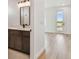 Elegant bathroom with contemporary vanity, sleek fixtures, offering a harmonious blend of modern design and natural light at 2832 W Vina Del Mar Blvd, St Pete Beach, FL 33706