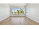 Bright bedroom with large windows that flood the space with natural light, featuring light hardwood floors at 2832 W Vina Del Mar Blvd, St Pete Beach, FL 33706