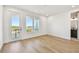 Spacious bedroom features wood floors, natural light from the three windows, and access to the outside balcony at 2832 W Vina Del Mar Blvd, St Pete Beach, FL 33706