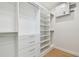 Well-organized walk-in closet with built-in shelving and drawers, offering plenty of storage for clothes and accessories at 2832 W Vina Del Mar Blvd, St Pete Beach, FL 33706