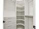 Organized walk-in closet offering ample storage solutions with built-in shelves and drawers to keep belongings tidy at 2832 W Vina Del Mar Blvd, St Pete Beach, FL 33706