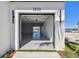 Open garage entrance showcasing a view of the canal, offering a glimpse of waterfront living and parking convenience at 2832 W Vina Del Mar Blvd, St Pete Beach, FL 33706