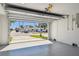 Well-lit garage with an open door, revealing a view of the street and a clean, organized space at 2832 W Vina Del Mar Blvd, St Pete Beach, FL 33706