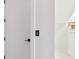 Bright white hallway with a light wood staircase and minimalist design at 2832 W Vina Del Mar Blvd, St Pete Beach, FL 33706