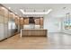 Open kitchen with stainless steel appliances, modern cabinetry, and a spacious center island at 2832 W Vina Del Mar Blvd, St Pete Beach, FL 33706
