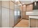 Modern kitchen featuring stainless steel appliances, custom cabinetry, and a large island with seating at 2832 W Vina Del Mar Blvd, St Pete Beach, FL 33706
