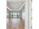 Spacious living room with recessed lighting and large sliding glass doors leading to the balcony at 2832 W Vina Del Mar Blvd, St Pete Beach, FL 33706