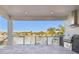 Outdoor space featuring a built-in grill, granite counters, and waterfront views at 2832 W Vina Del Mar Blvd, St Pete Beach, FL 33706
