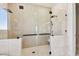 Modern shower featuring dual shower heads, glass doors, and tile surround at 2832 W Vina Del Mar Blvd, St Pete Beach, FL 33706