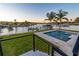 Backyard pool with bay views, steps, and grassy area at 2832 W Vina Del Mar Blvd, St Pete Beach, FL 33706
