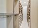Large walk-in closet with custom shelving and hanging space at 2832 W Vina Del Mar Blvd, St Pete Beach, FL 33706