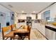 Bright kitchen featuring white cabinets and granite countertops at 207 Orange Dr, Lutz, FL 33548