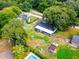 Aerial view of the house, backyard with shed and pool at 207 Orange Dr, Lutz, FL 33548