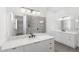 Elegant bathroom with dual vanity, quartz countertop and walk-in shower at 1810 4Th E St, Palmetto, FL 34221